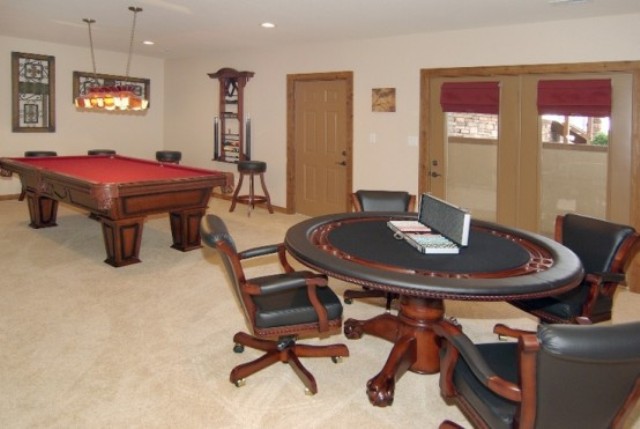 a poker table and a modern pool table are right what you need to have fun with your guests