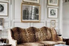 18 panelling, a gallery wall and a refined cheetah print sofa look very traditional and chic