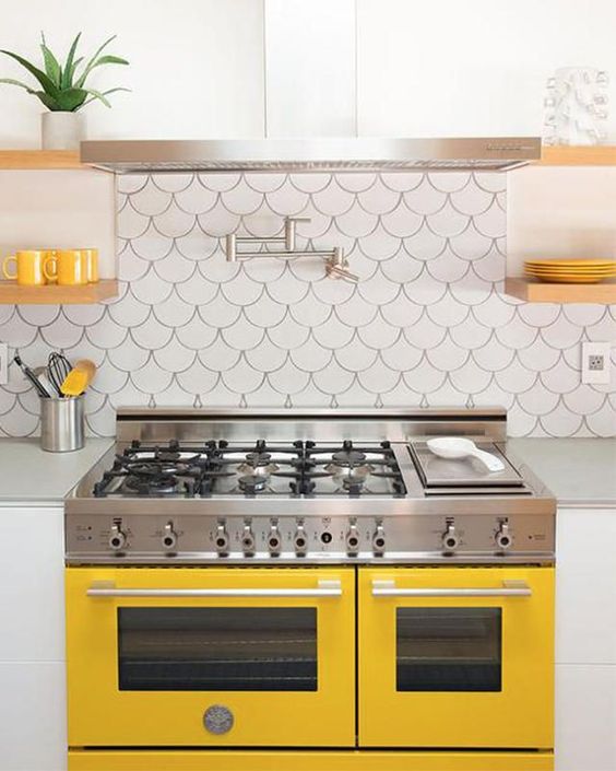 a sunny yellow cooker and matching touches for a chic modern kitchen