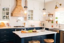 20 dark blue kitchen cabinets with marble countertops and suspended white cabinets