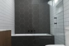 20 matte graphite grey hexagon tiles and white subway ones create an interesting and eye-catchy space