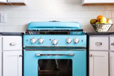 23 a retro bold blue stove and a matching hood to make a cool statement in your space