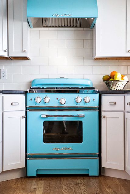 a retro bold blue stove and a matching hood to make a cool statement in your space