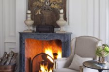 24 a vintage fireplace is used to make the living room cozier and is styled with a large wooden artwork