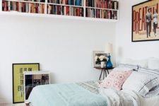 24 bookshelves under the ceiling won’t take any floor space but will provide much reading