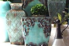 24 shabby aqua pots with a touch of rust look amazing in a Mediterranean interior