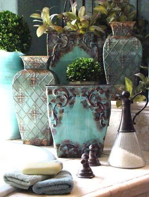 shabby aqua pots with a touch of rust look amazing in a Mediterranean interior