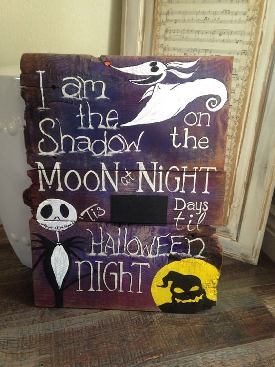 a Nightmare Before Christmas countdown sign in purple, black, white and yellow