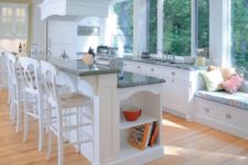25 a two-level kitchen island with two level for cooking and eating perfectly fits a traditional kitchen