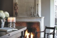 25 a vintage stone clad fireplace with brick inside adds a cozy feel to the dining space