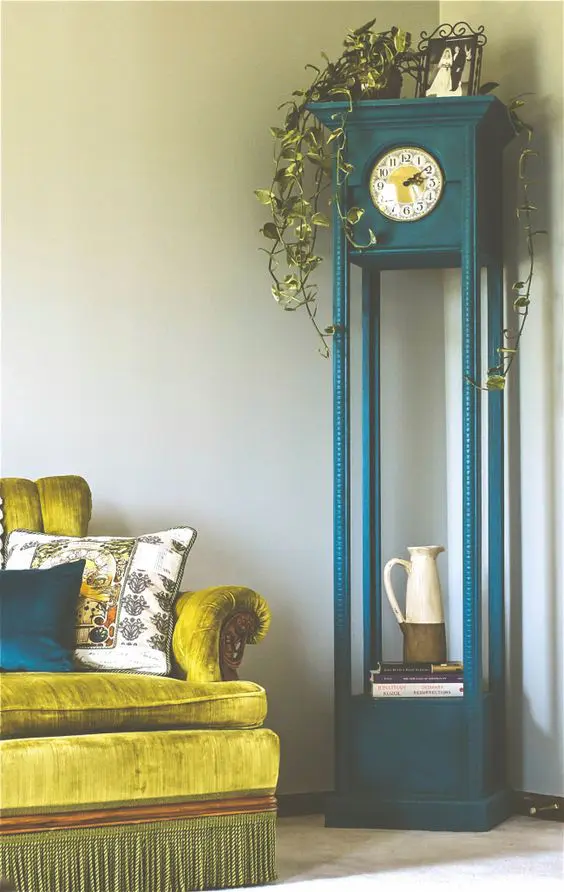paint the clock in a bold shade, for example, teal, and use the lower part as a shelf
