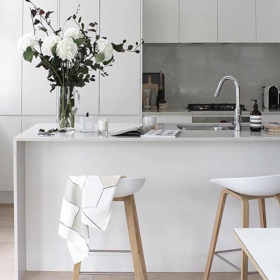 a kitchen island doubles as a kitchen countertop for eating