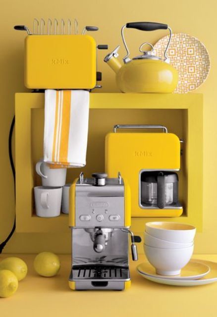 a set of sunny yellow kitchen appliances with a stainless steel touch for a sunny mood