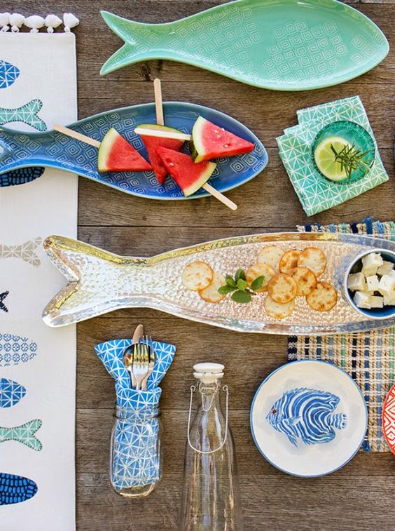 fish shaped and painted dishes and plates are perfect for a Mediterranean dining space