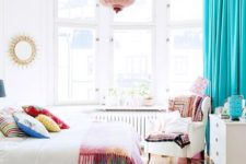 26 turquoise curtains and bedspreads and pillows add cheer to this white bedroom