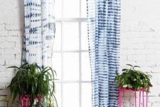 27 shibori curtains stand out in front of whitewashed brick walls