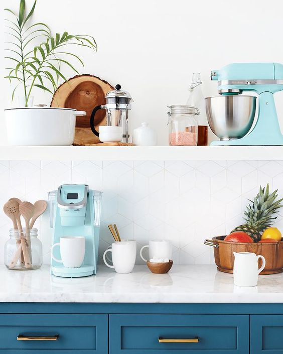 a tiffany blue coffee machine and mixer for a chic blue and brass kitchen