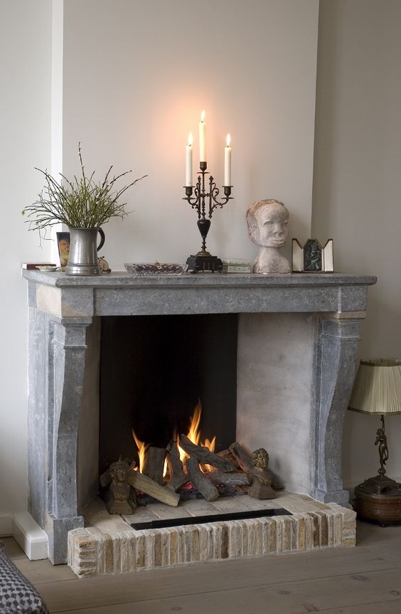 use your antique stone and brick fireplace as a real one if it allows, why not add a cozy feel