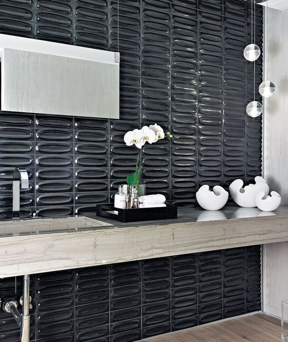 textural glossy black tiles make the bathroom refined, chic and eye-catchy