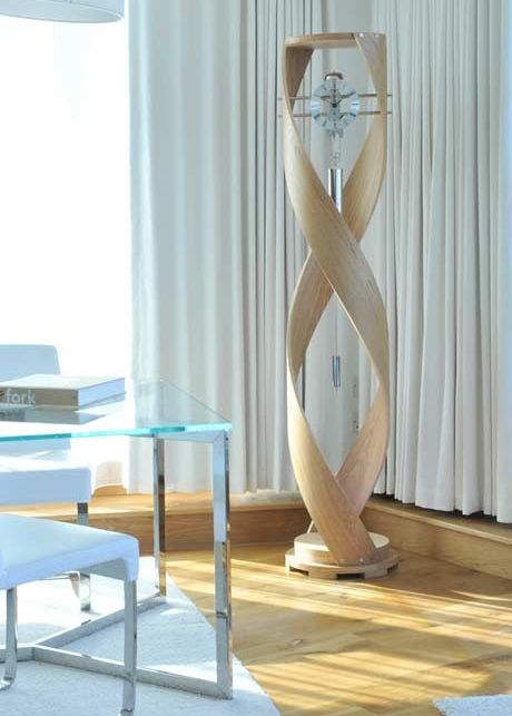 An ultra modern grandfather's clock of glass, metal and light colored wood