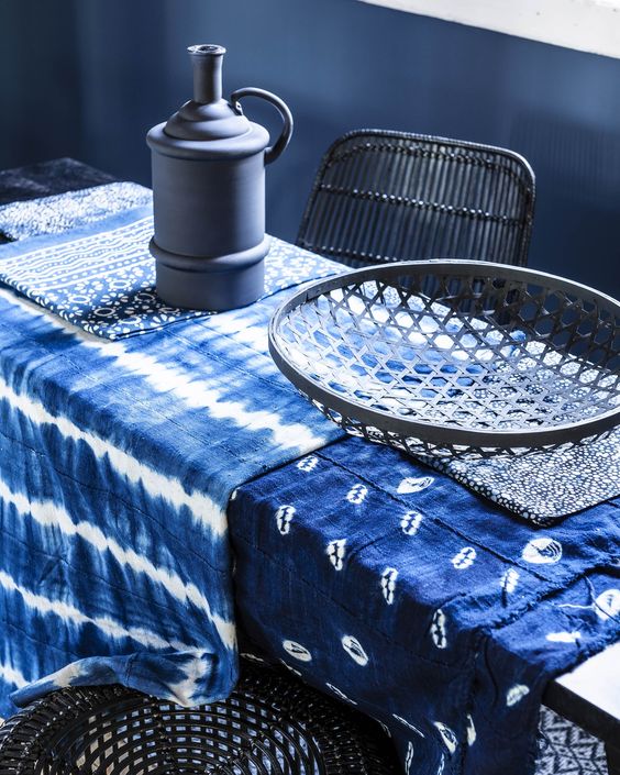 shibori tablecloths make this moody dining space cooler
