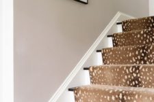 32 deer spot print rug covers the stairs and makes the space cozier