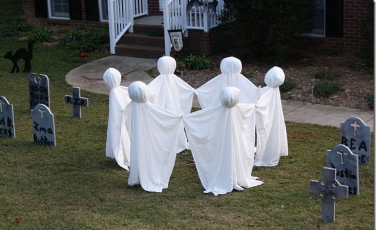 a bunch of graves and ghosts dancing around them would turn your front yard into a creepy place