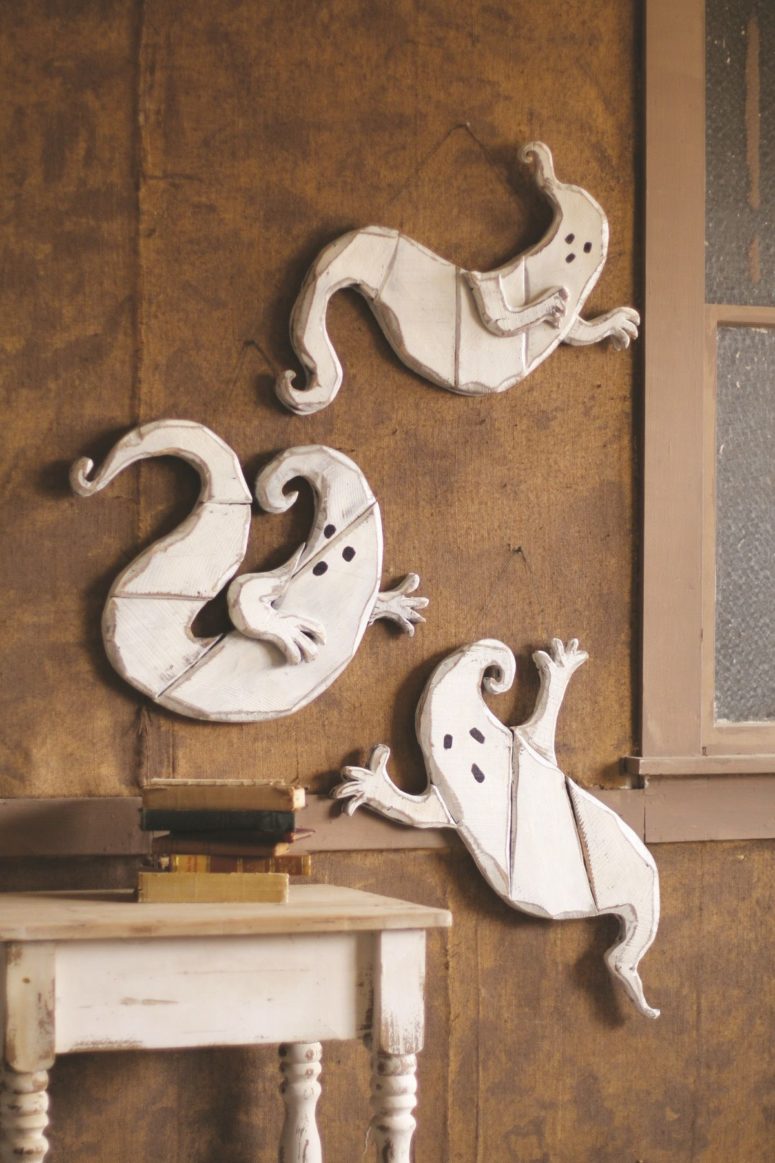 make wooden ghosts and hang them on a wall during this awesome season