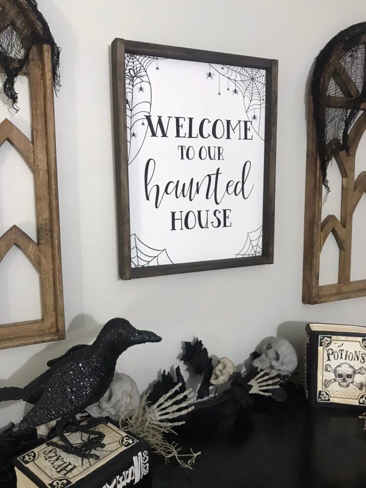 welcome to a haunted house sign could be used as a wreath as a wall art piece
