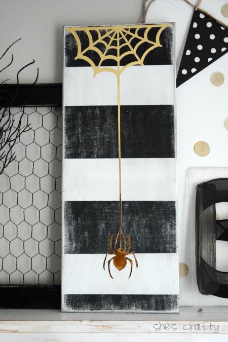 a reclaimed board and some shiny paper could be used to make a cool diy halloween sign
