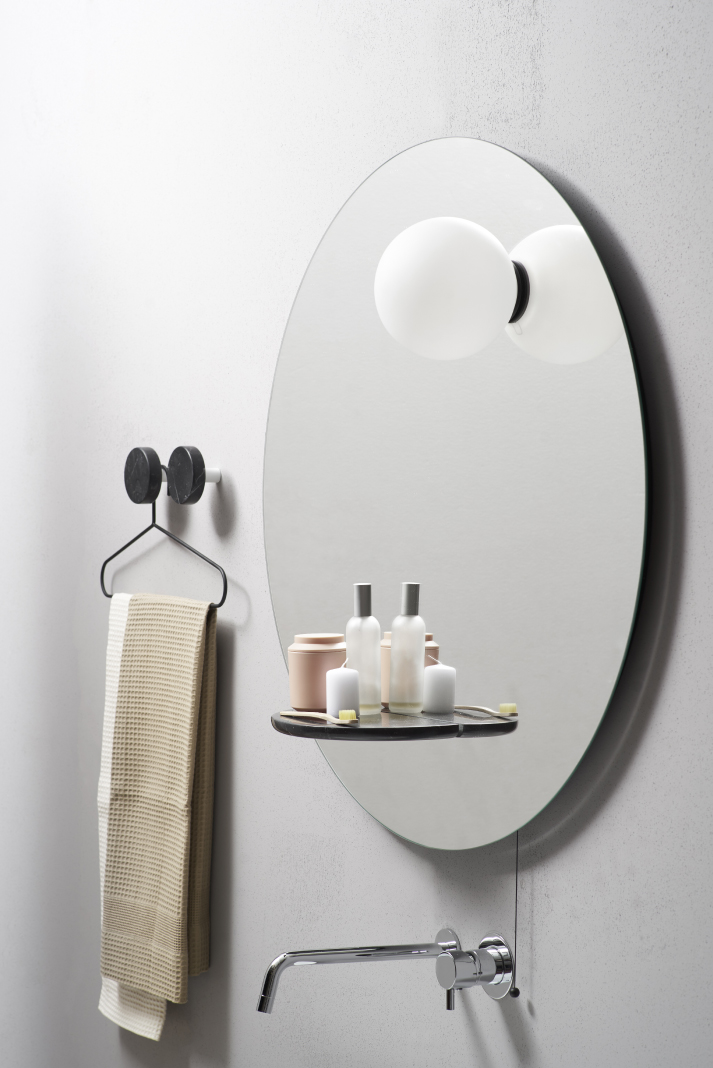 Float is a functional modern mirror inspired by planets and gravity and featuring additional light and storage