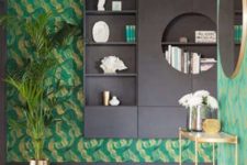 01 The entryway of this quirky penthouse is done with bold emerald anad gold wallpaper and lots of gilded details