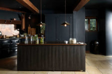 01 This stunning dark space was created by deVOL for one cottage, and its vintage moody decor really stands out