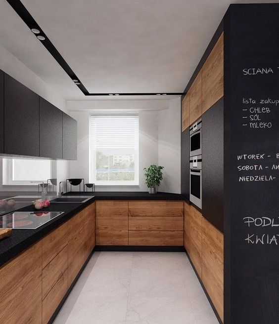 a matte black kitchen with natural wood surfaces looks modern, edgy and is very functional