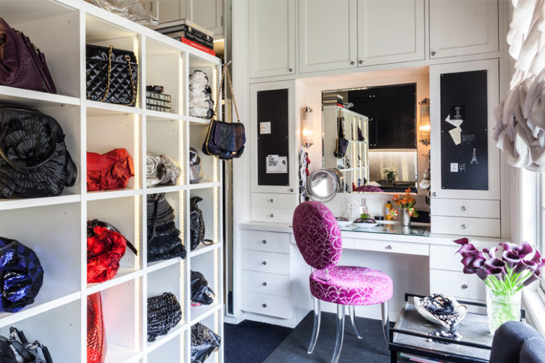There's a shelving unit for bags, a cute makeup nook with several mirrors and chalkboard drawers and ruffled curtains