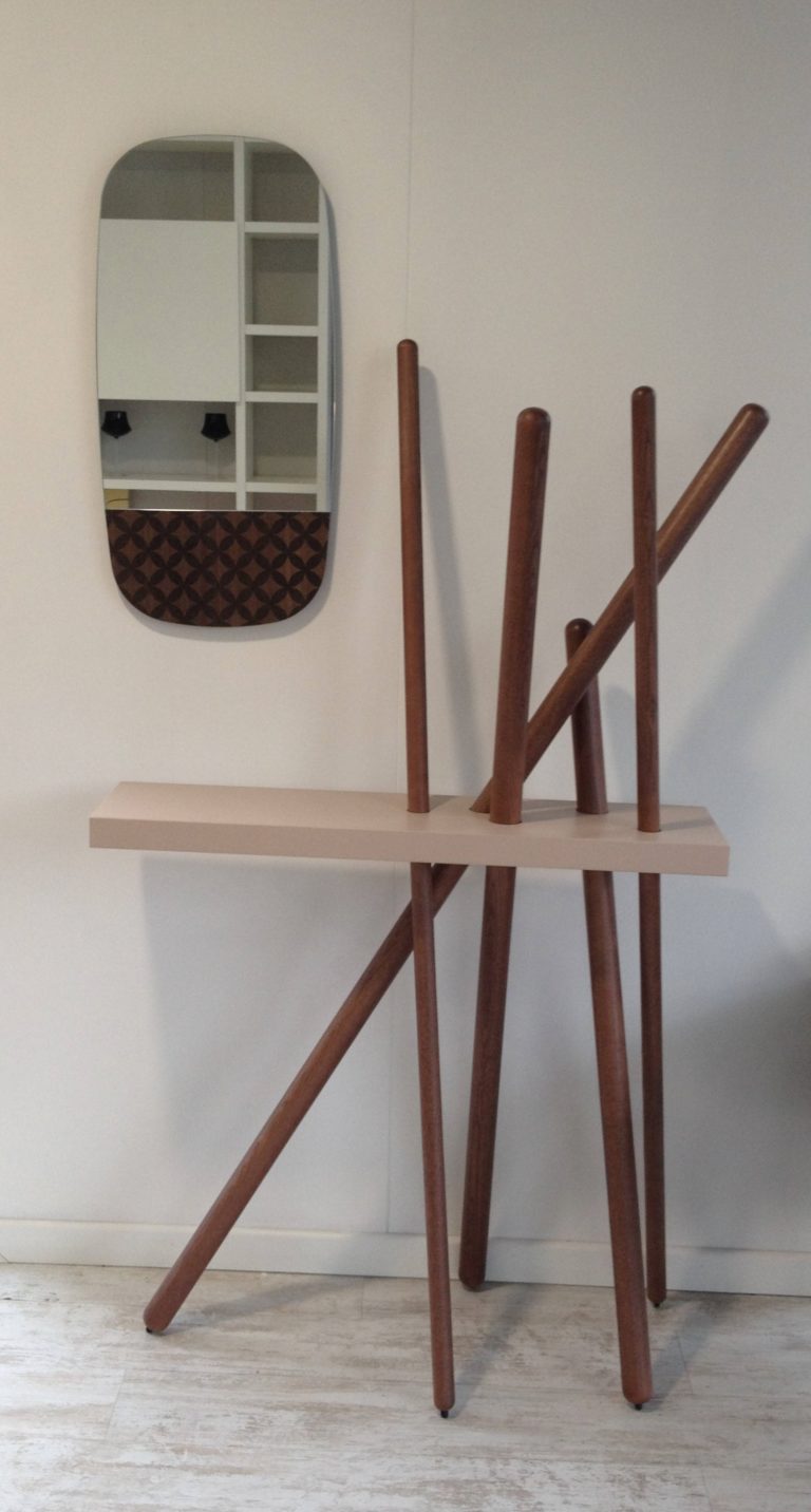 This is a coat hanger and a console and can be used throughout home for the same purposes, not only in entryways