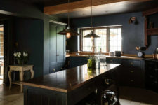 04 There’s a large kitchen island with storage, some vintage accessories like scales and industrial pendant lamps