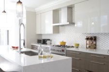 04 a modern space with sleek white cabinets and wooden ones, a geo tile backsplash and a marble kitchen island