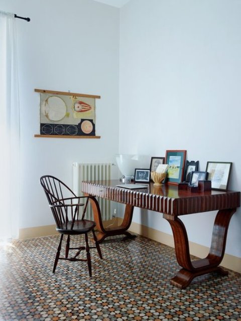 An Italian 20th century desk paired with an American Windsor chair