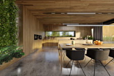 05 The dining zone is done with a wooden table and black modern chairs