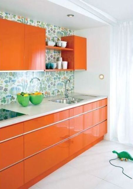 modern orange kitchen with a floral backsplash looks cute and cheerful