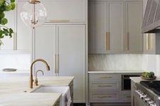 06 a vintage light grey kitchen with brass touches and antique-styles fixtures looks elegant
