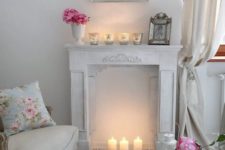 06 warm up your space with a faux fireplace with candles inside it and on it