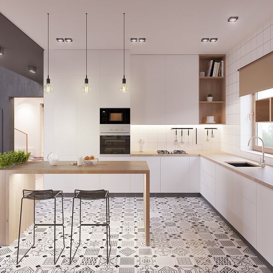 a modern space with white cabinets, wooden counters and a kitchen island and a cool mosaic tile floor