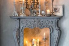 07 a vintage fireplace like this one can become an eye-catchy part of the decor, add more candles