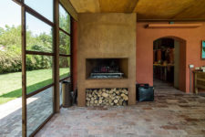 08 There’s a real working fireplace with wood storage, which adds coziness and a homey feel
