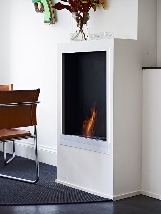a stylish ethanol fireplace is a great idea to add coziness and warmth to your space
