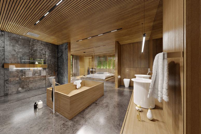The master bathroom is very large, natural wood gives it a spa feel
