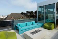 09 The modern terrace features cool edgy furniture in turquoise and bold green