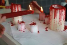 09 candles dripping blood are a simple and cool touch to a vampire party space